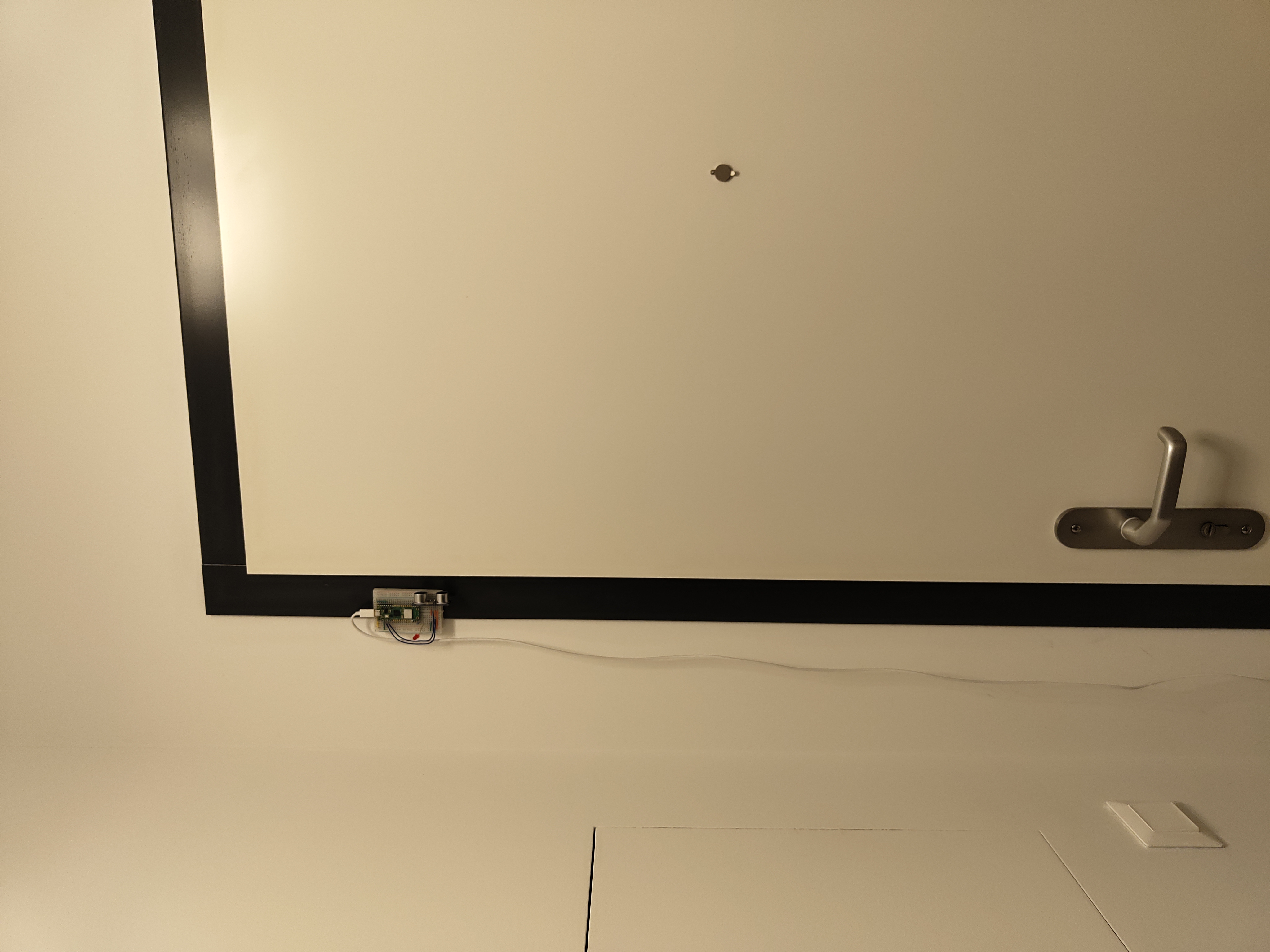 door alarm peripheral device on door frame